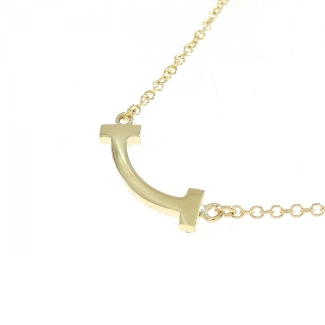 Tiffany T diamond and turquoise circle pendant in 18k gold. | Tiffany & Co.