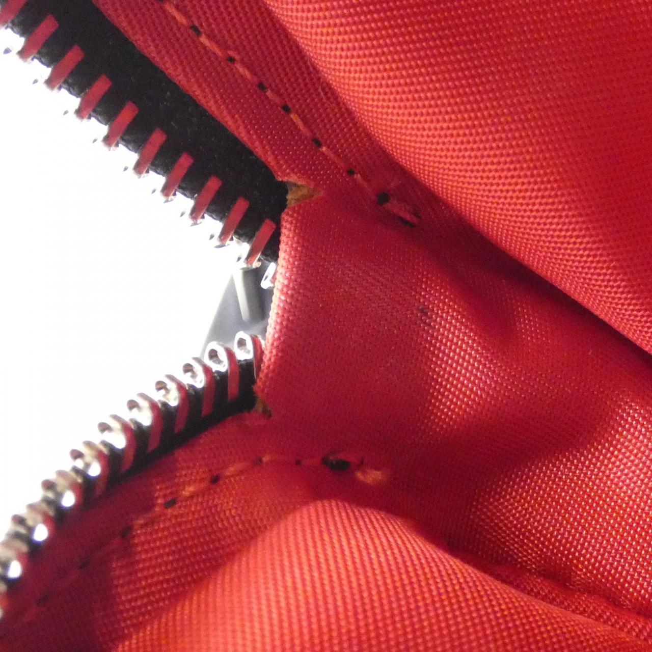 CHRISTIAN LOUBOUTIN BACKLOUBI SMALL LOVE Backpack