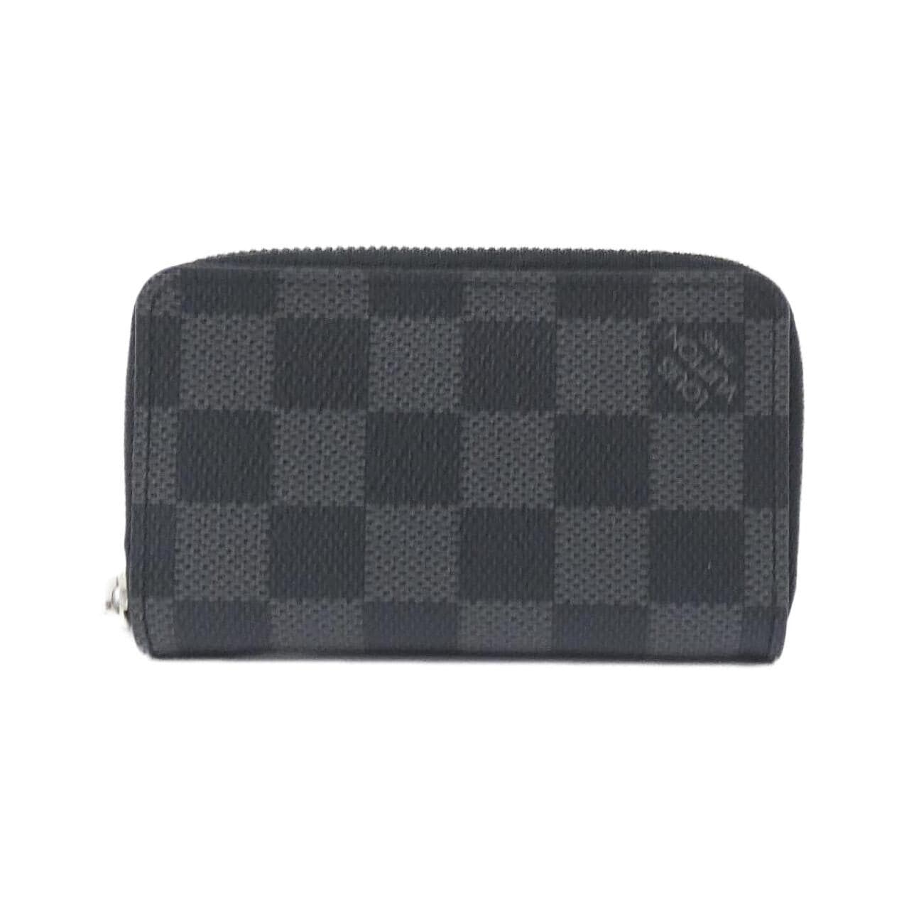 LOUIS VUITTON. Coin purse in black epi leather, Half moo… | Drouot.com