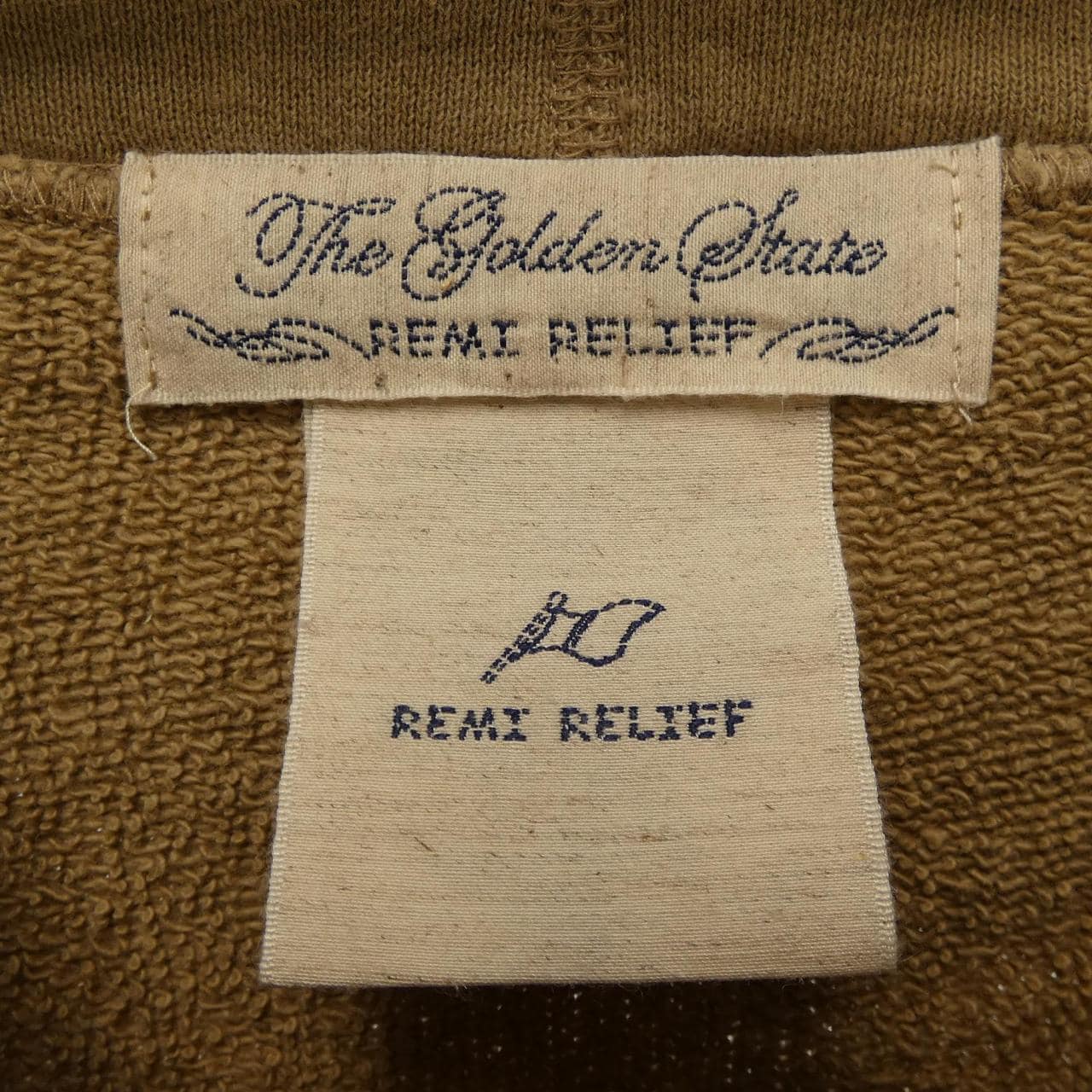 レミレリーフ REMI RELIEF パーカー