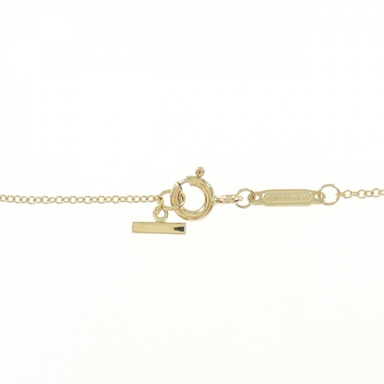Elsa Peretti® Alphabet Letter T Pendant in Silver, Small | Tiffany & Co.