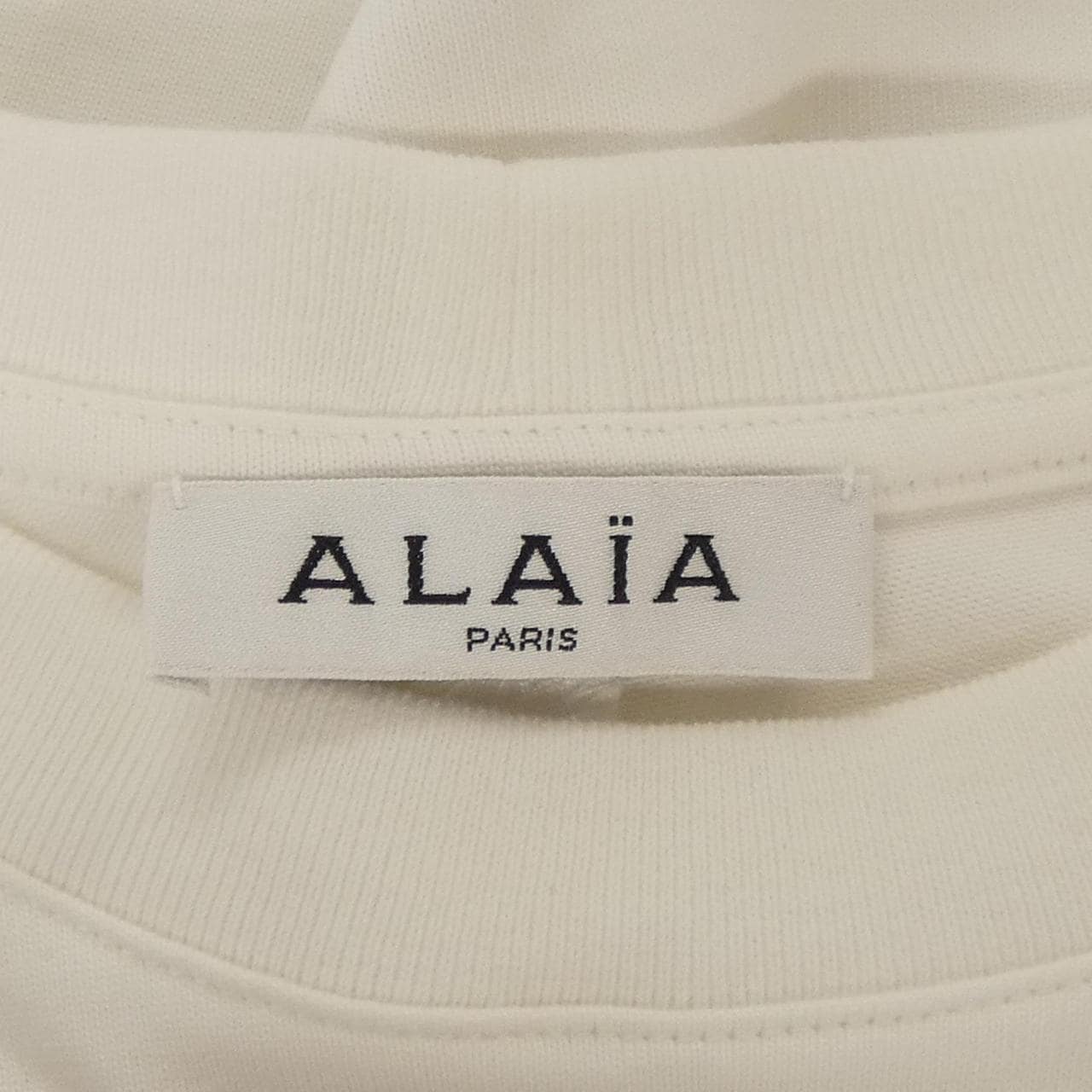 アライア ALAIA AA9H02911J017 Tシャツ