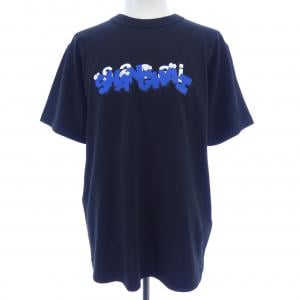 サカイ SACAI KAWS HOLIDAY XX Tシャツ
