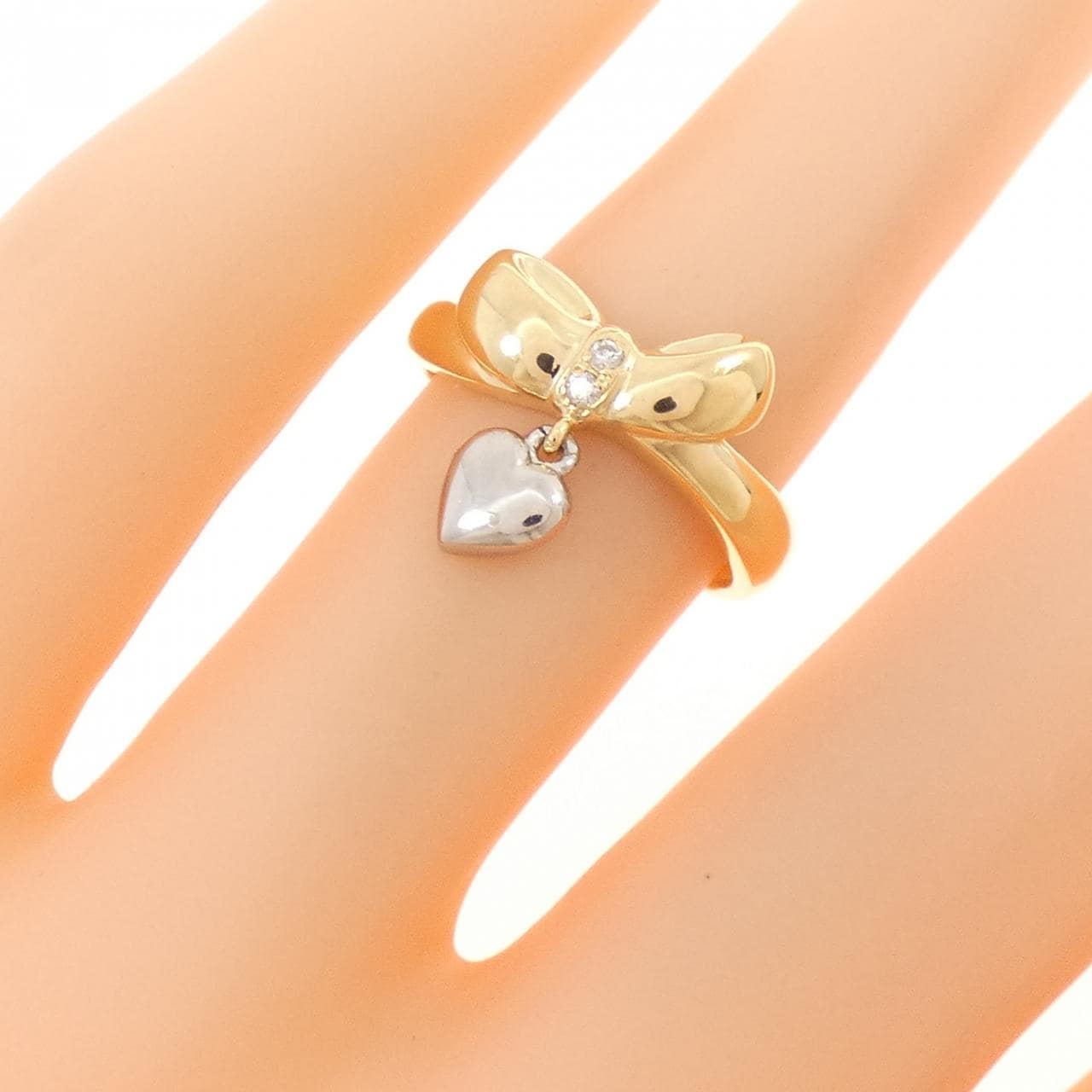 K18YG/PT900 リボン×ハート ダイヤモンド リング 0.02CT