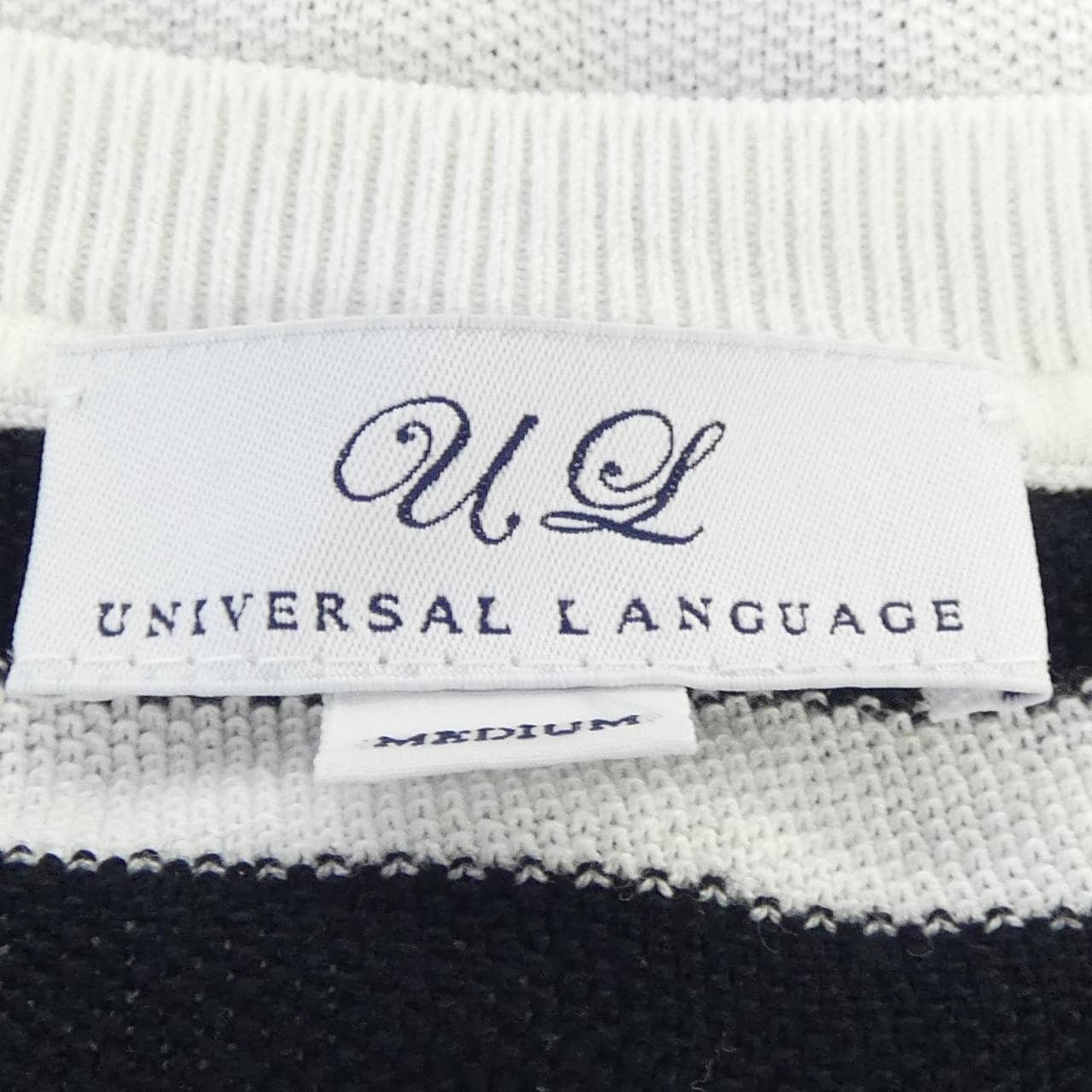 ユニバーサルランゲージ UNIVERSAL LANGUAGE トップス