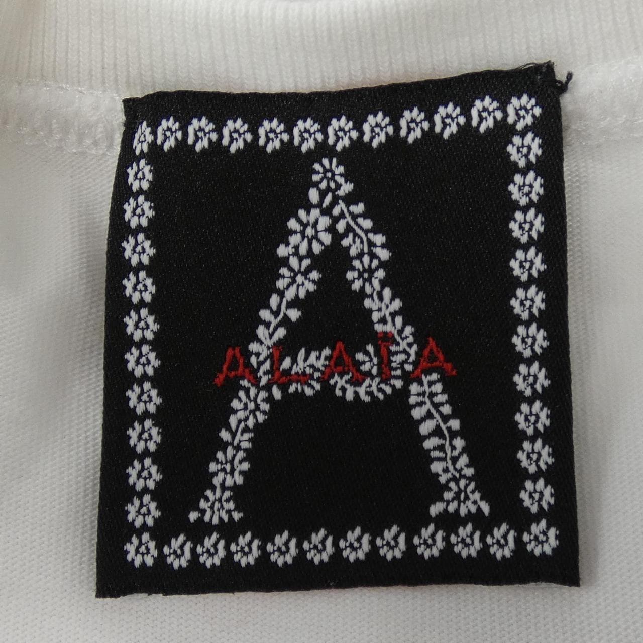アライア ALAIA AE9UG83RT193 Tシャツ