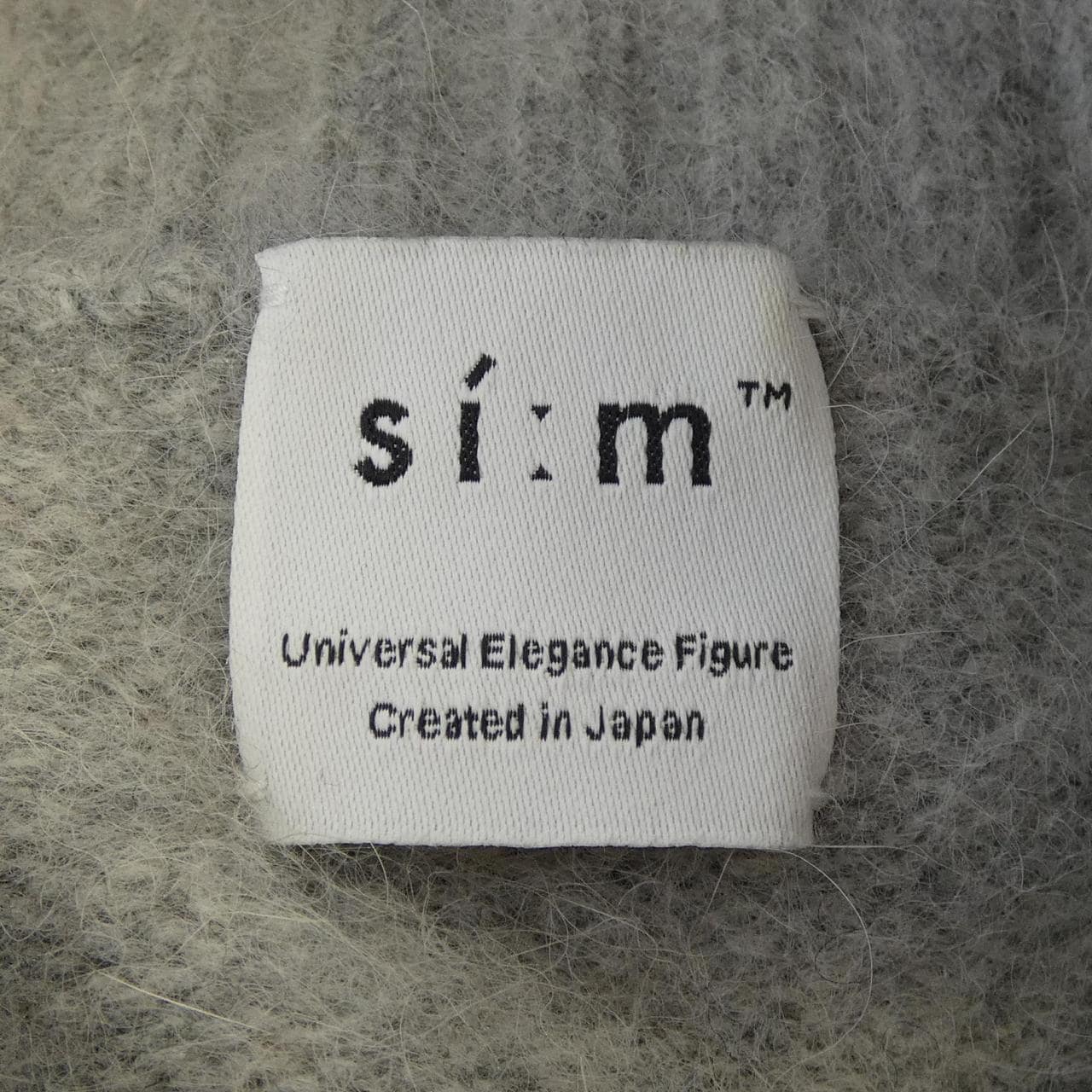 SIM ニット