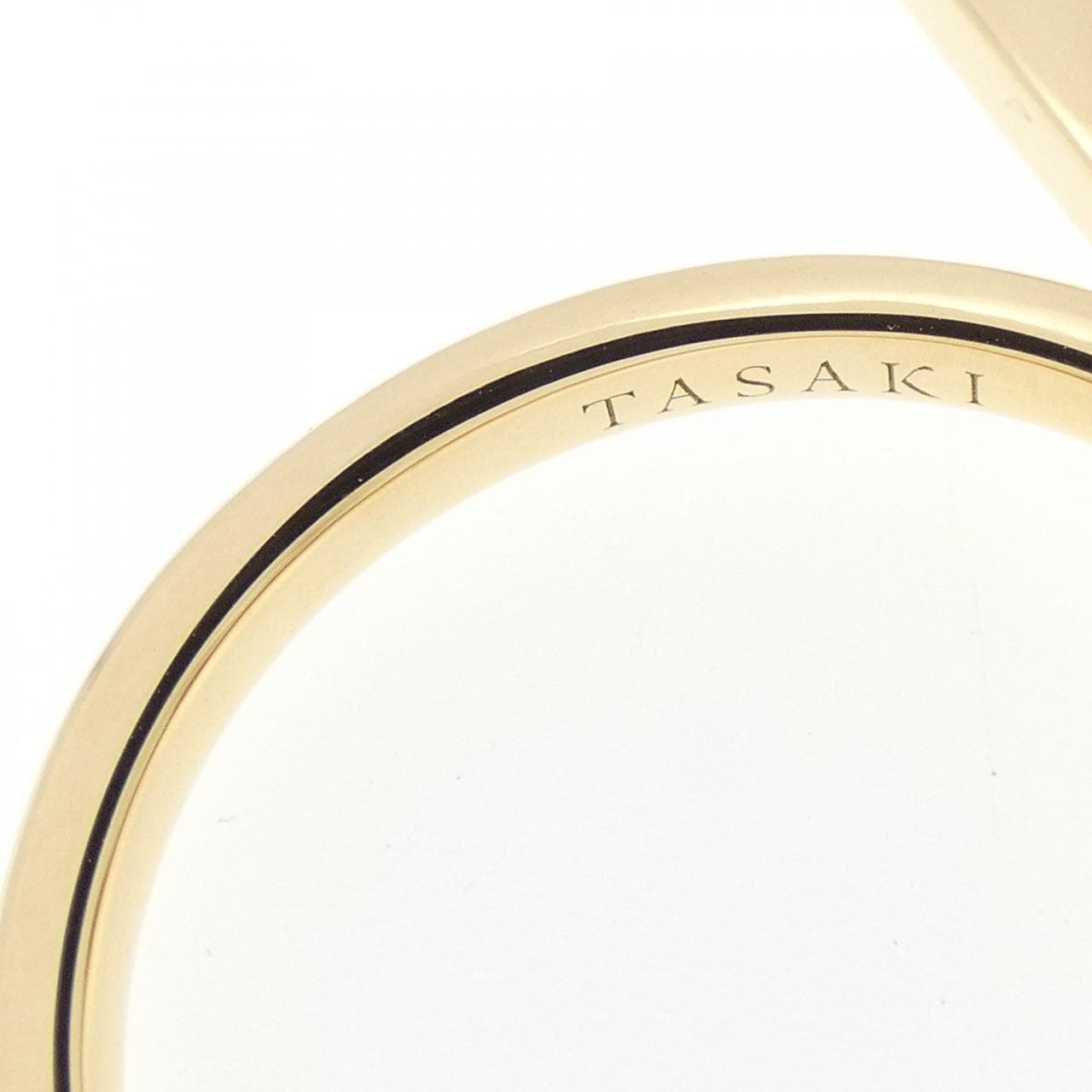 Tasaki balance signature ring