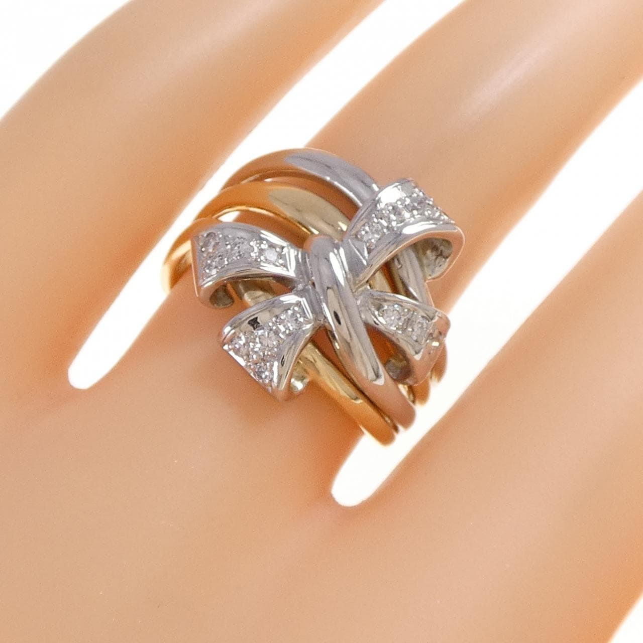 K18YG/PT900 リボン ダイヤモンド リング 0.19CT